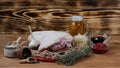 Raw pork ham meat with ingredients , preparation on aged cutting board. Authentic lifestyle image. Oktovber recipe for festival Royalty Free Stock Photo