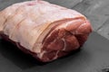 Raw pork joint of meat on slate Royalty Free Stock Photo