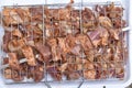 Raw pork meat in a barbecue net with spices Royalty Free Stock Photo