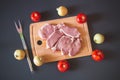 Raw pork meat. Fresh steaks on cutting board Royalty Free Stock Photo