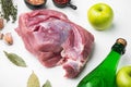 Raw pork meat and ingredients for roast, with apple dry cider, on white stone table background Royalty Free Stock Photo