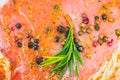 Raw Pork meat with spices and green rosemary herb. Red meat texture background, Raw ham. Macro photo. Fat Fresh juicy steak Royalty Free Stock Photo