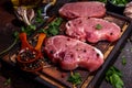 Raw pork meat steaks cooking background