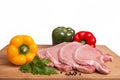 Raw pork meat, vegetables and spices, arranged on kitchen board Royalty Free Stock Photo