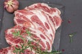 Raw pork neck meat. Chop steak, red peppercorn, garlic cloves, sea salt and fresh rosemary Royalty Free Stock Photo