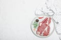 Raw pork neck meat. Chop steak, red peppercorn, garlic cloves, sea salt and fresh rosemary Royalty Free Stock Photo