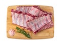 Raw pork ribs. Arrangement on cutting board. Chop Ribs. Pork belly ribs, isolated on white background. top view Royalty Free Stock Photo