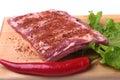 Raw pork ribs with herbs and spices on wooden board. Ready for cooking. Royalty Free Stock Photo