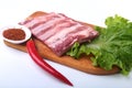 Raw pork ribs with herbs and spices on wooden board. Ready for cooking. Royalty Free Stock Photo