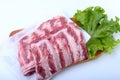 Raw pork ribs with herbs and spices on wooden board. Ready for cooking. Royalty Free Stock Photo