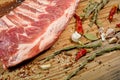 Raw pork ribs laid out on a round cutting board.Spices for cooking meat dishes, close-up.Selective Focus Royalty Free Stock Photo