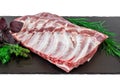 Raw pork ribs. Whole raw pork ribs on dark black background. Raw meat, farm and cooking concept. Meat shop Royalty Free Stock Photo