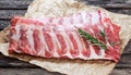 Raw Pork ribs with a rosemary. on crumpled paper Royalty Free Stock Photo