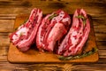 Raw pork ribs with spices and rosemary on a cutting board Royalty Free Stock Photo