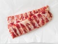 Raw pork ribs on white parchment paper, top view Royalty Free Stock Photo