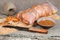 Raw pork roll package for roasting on wooden cutting board Royalty Free Stock Photo