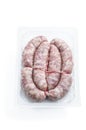 Raw pork sausages in plastic pack isolated on white background Royalty Free Stock Photo