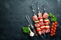 Raw pork shish kebab. BBQ meat with vegetables and spices. Top view. Free space for your text. Royalty Free Stock Photo