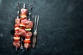 Raw pork shish kebab. BBQ meat with vegetables and spices. Top view. Royalty Free Stock Photo