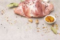 Raw pork shoulder with spices. Bay leaf, garlic. On a stone background Royalty Free Stock Photo