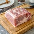 Raw Pork Shoulder Square Cut on Kitchen Cutting Board Royalty Free Stock Photo