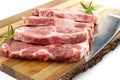 Raw pork steak on wood cutting board. Pork with spices: rosemary and pepper. Close-up raw pork steaks. Royalty Free Stock Photo