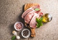 Raw pork  steaks with spices, herbs on cutting  board. Fresh meat. Top view copy space Royalty Free Stock Photo