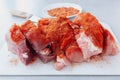 Raw pork tenderloin covered in dry rub spices and cut in smaller pieces ready for roasting Royalty Free Stock Photo