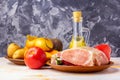 Raw pork tenderloin, ready to roast, with spices, black pepper, olive oil, garlic, bay leaf, salt Royalty Free Stock Photo