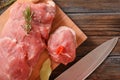 Raw pork tenderloin, rosemary, chili, knife on a wooden Royalty Free Stock Photo