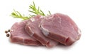 Raw pork tenderloin sirloin steaks chunks, juicy and fresh. Isolated on white background. With rosemary leaves and black Royalty Free Stock Photo