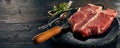 Raw porterhouse steak and fresh herbs Royalty Free Stock Photo