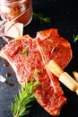 Raw porterhouse steak with spicy seasoning Royalty Free Stock Photo
