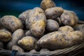 Raw potatoes in baskets on the market Royalty Free Stock Photo