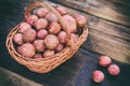 Raw potatoes in a brown wicker basket Royalty Free Stock Photo