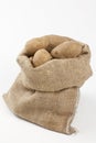Raw potatoes in burlap bag Royalty Free Stock Photo