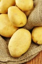 Raw potatoes in jute sack