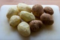 Raw Potatoes, Peeled and Unpeeled Royalty Free Stock Photo