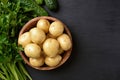 Raw potatoes in wooden bowl Royalty Free Stock Photo