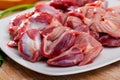 Raw chicken gizzards on wooden table Royalty Free Stock Photo