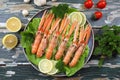 Raw prawns on green salad