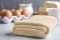 Raw puff pastry dough and  on grey table Royalty Free Stock Photo