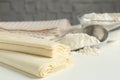 Raw puff pastry dough on white table, closeup. Space for text Royalty Free Stock Photo