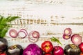 Raw purple vegetables and fruit on white wooden background top view