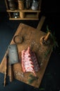 Raw rack of lamb with spices on a cutting board Royalty Free Stock Photo