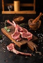 Raw rack of lamb with spices on a cutting board Royalty Free Stock Photo