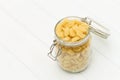 Raw radiatori pasta on a glass jar Royalty Free Stock Photo