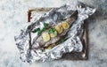 Raw rainbow trout in foil