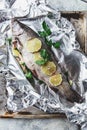 Raw rainbow trout in foil
