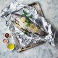 Raw rainbow trout in foil